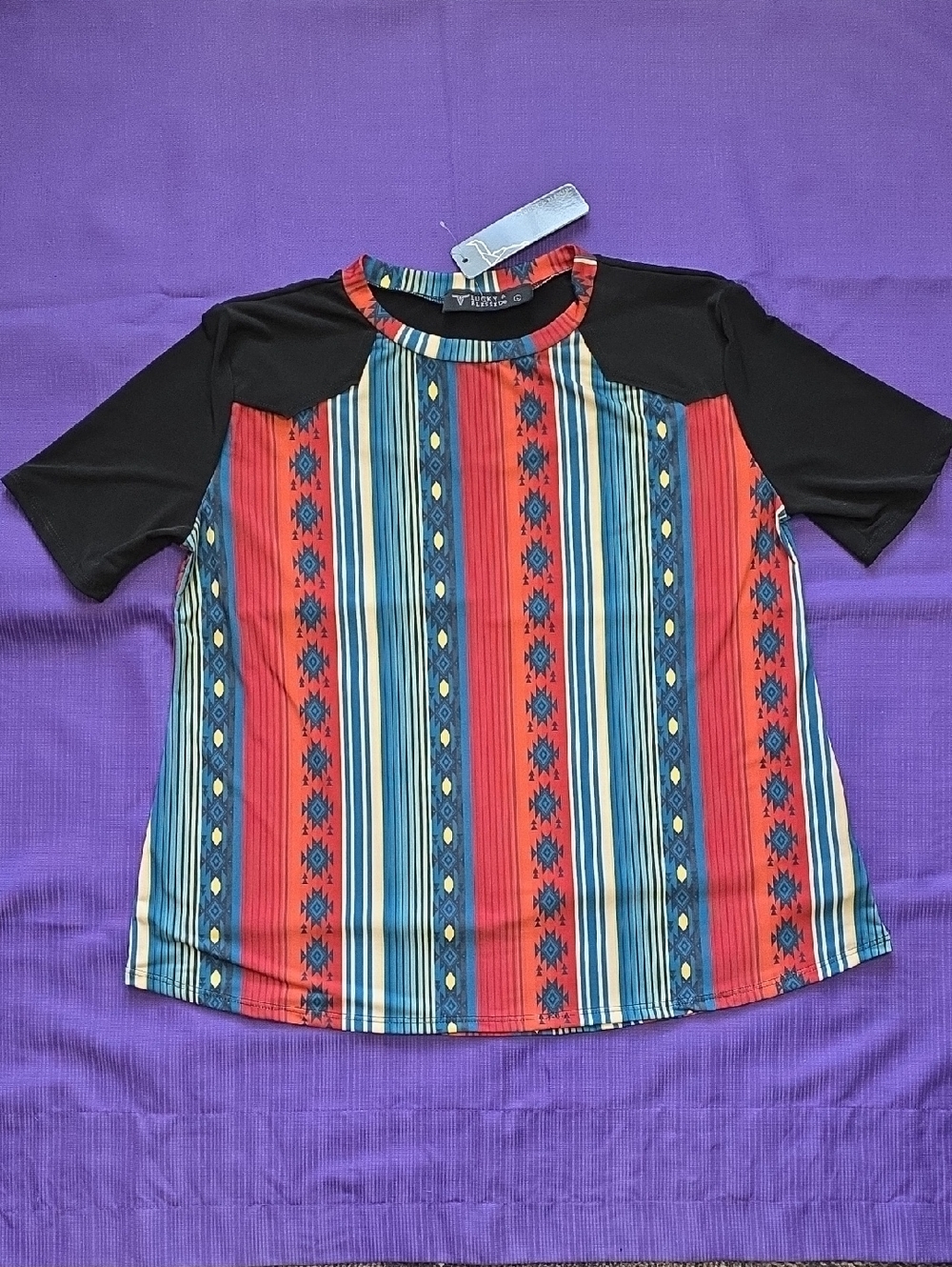 Lucky & Blessed Black Raglan Tee with Red & Blue Aztec Stripe Front